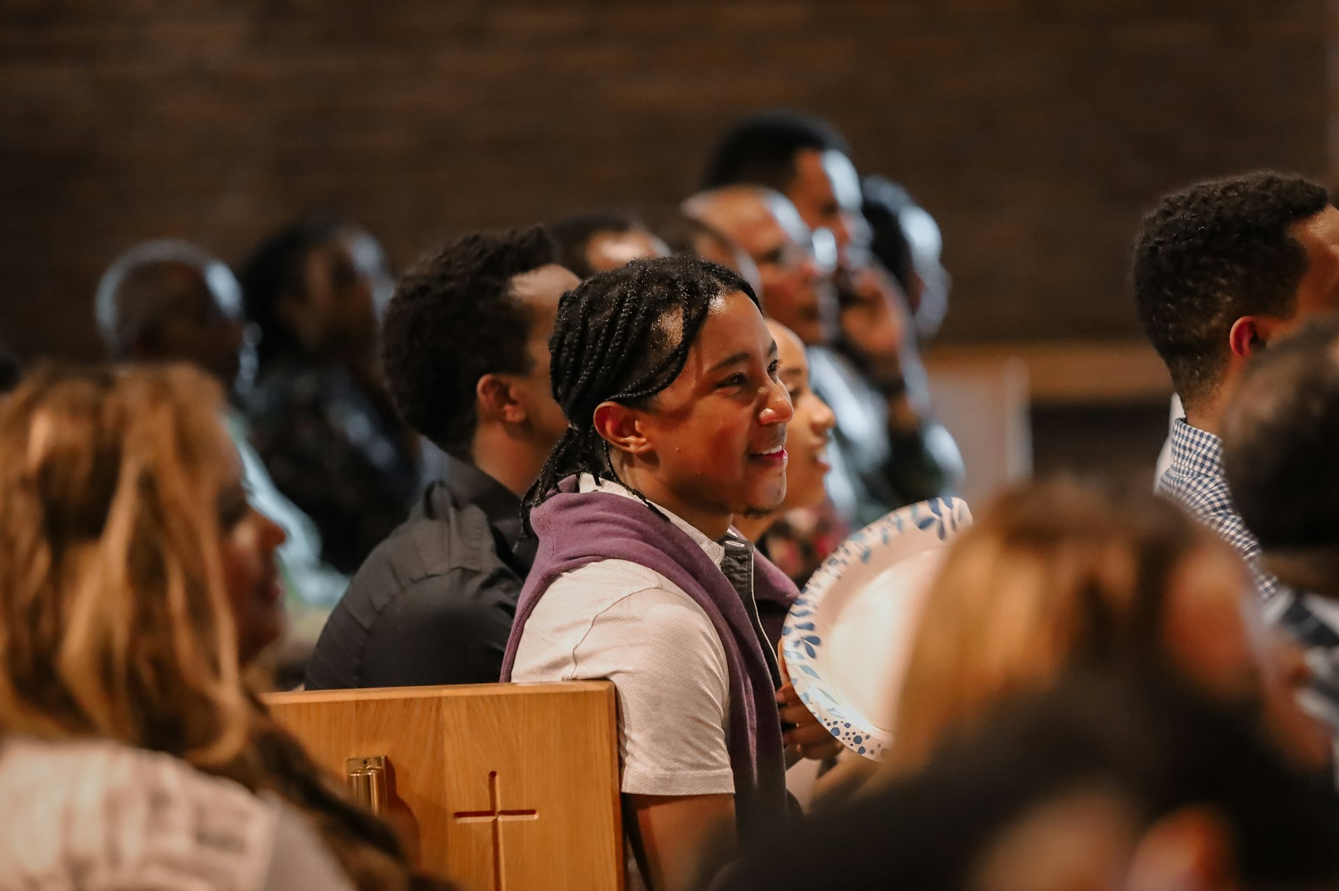 People are gathered, perhaps attending a religious service.